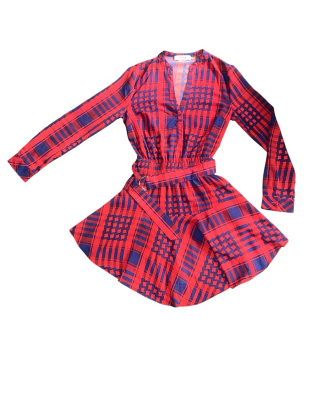 Asymmetrical dress features a bold red and blue plaid jacquard pattern. Small